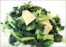  ??  ?? Green vegetables fried with bamboo shoots