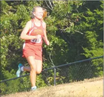  ?? STAFF PHOTO BY ANDY STATES ?? North Point’s Rachel Nueslein runs during the latter stages of the girls cross country race at Wednesday afternoon’s quad-meet at North Point. Nueslein finished third in the girls race in a time of 19 minutes 52.95 seconds in a meet that also included the teams from Calvert, La Plata and Northern.