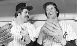  ?? HARRY HARRIS/ASSOCIATED PRESS ?? Mr. Holtzman (right), then with the Yankees, with fellow pitcher Jim Catfish Hunter at Yankee Stadium, Oct. 6, 1977.