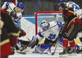  ?? CHERIE MORGAN/Special to The Okanagan Weekend ?? Penticton Vees goaltender Derek Krall keeps the puck out against the West Kelowna Warriors during Friday’s game at the SOEC.