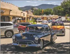  ?? ?? Left: Dozens of classic cars filled the plaza on Friday (Aug. 5) during a memorial ride for Max Madrid, a member of the Taos Auto Cruise Organizati­on and beloved member of the community.