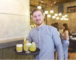  ??  ?? Drink up: Mixologist Jason Grey created the drink list for Toast Asian Kitchen.