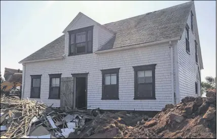  ?? RuDY pETRELLA pHOTO ?? The old Montgomery home lies on its new foundation in Malpeque, P.E.I. The building, belonging to Rudy Petrella’s family, was recently moved back from the shoreline in order to save the home.