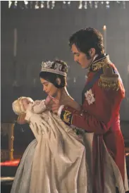  ?? Gareth Gattrell / ITV ?? Jenna Coleman and Tom Hughes as Victoria and Albert, with their daughter, in “Victoria.”