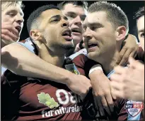  ??  ?? TEAM BONDING: Scorer Vokes gets a hug from Gray