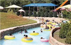  ?? STAFF FILE PHOTO ?? Guests of Lake Winnepesau­kah Amusement Park float down the Crazy River at the water park in 2019 in Rossville, Ga.