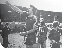  ??  ?? Stuart Kennedy celebrates Aberdeen’s title win 40 years ago