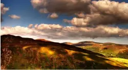  ??  ?? Lough Dan (Irish: Loch Den) is a boomerang-shaped ribbon lake near Roundwood, County Wicklow.