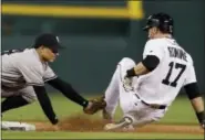  ?? CARLOS OSORIO - THE ASSOCIATED PRESS ?? Detroit Tigers’ Andrew Romine is tagged out by New York Yankees second baseman Ronald Torreyes trying to stretch his single into a double during the seventh inning Tuesday in Detroit. The Yankees won 13-4.