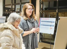  ?? COURTESY PHOTOS ?? Carol Wallace, left, a 52-year Hebron resident, and Laura Roeske, whose husband’s family has farmed in Hebron since the 19th century, study an informatio­n board on possible comprehens­ive plan updates at The Design Barn on Wednesday.