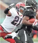  ??  ?? Memphis Express cornerback Terrell Bonds tackles Birmingham Iron wide receiver Devozea Felton on Sunday at Legion Field.