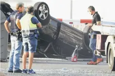  ?? AFP photo ?? Policemen check a car involved in a terrorist attack in Cambrils, Barcelona.—