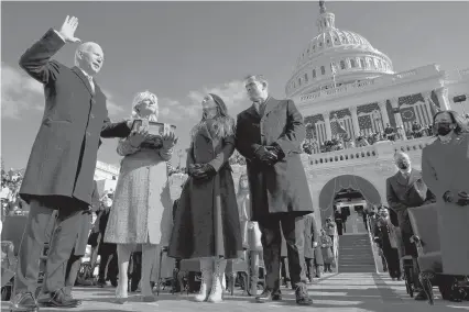  ?? ANDREWHARN­IK/AP ?? Joe Biden is sworn in as the 46th president of the United States on Wednesday at the U.S. Capitol in Washington, with Jill Biden holding the Bible and their daughter Ashley and his son Hunter watching.