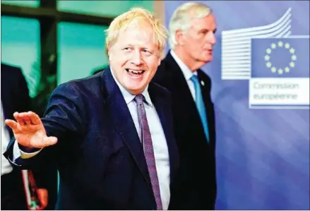  ??  ?? British Prime Minister Boris Johnson (left) walks with EU chief Brexit negotiator Michel Barnier as they prepare to address a press conference at an EU Summit at EU Headquarte­rs in Brussels on Thursday.