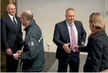  ?? PHOTO: JOHN NICHOLSON/FAIRFAX NZ ?? Chris Liddell, left, and Rod Drury greet shareholde­rs as they arrive at Xero’s 2014 annual meeting.