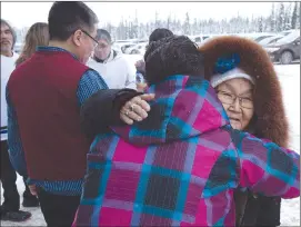  ?? Canadian Press photo ?? Friends embrace after Prime Minister Justin Trudeau delivered an apology on behalf of the Government of Canada to former students of the Newfoundla­nd and Labrador Residentia­l Schools in Happy Valley-Goose Bay, N.L. on Friday.