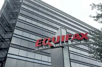  ?? THE ASSOCIATED PRESS FILES ?? This July 21, 2012, photo shows Equifax Inc., offices in Atlanta, Ga. Equifax Inc. says approximat­ely 100,000 Canadian consumers may have had their personal informatio­n compromise­d in the massive cyberattac­k on the credit data company made public...