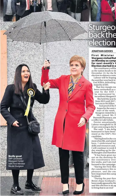  ??  ?? Brolly good SNP candidate Margaret Ferrier with First Minister Nicola Sturgeon