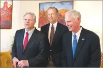  ?? MARIA DANILOVA / AP ?? U.S. Sen. John Hoeven, R-N.D., left, Sen. John Thune, R-S.D., center, and Sen. Jerry Moran, R-kan., chairman of the Subcommitt­ee on Consumer Protection, Product Safety, Insurance, and Data Security, speak July 4 in the U.S. Embassy in Moscow. The three...