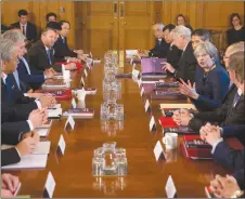  ?? AP PHOTO ?? Britain’s Prime Minister Theresa May, centre right, speaks as she hosts a roundtable with Japanese investors in the U.K. inside 10 Downing Street in central London amid concerns that billions in investment are at risk because of Brexit.