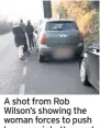  ??  ?? A shot from Rob Wilson’s showing the woman forces to push her pram into the road