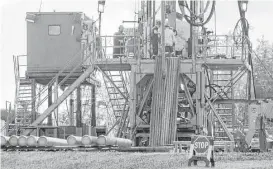  ?? Keith Srakocic / Associated Press file ?? A crew works on a natural gas drilling rig at a site in Pennsylvan­ia. The Trump administra­tion is reversing a rule pertaining to drilling on public lands.