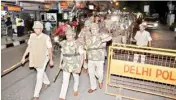  ?? PIC/MPOST ?? Cops during a flag march in Shahdara on Saturday