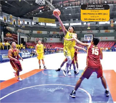  ?? PAUL JUN E. ROSAROSO ?? UC point guard Darrell Shane Menina soars over a CIT-U defender during their CESAFI collegiate basketball match last night at the Cebu Coliseum. UC won, 81-67.
