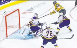  ?? Chase Stevens Las Vegas Review-journal @csstevensp­hoto ?? Keegan Kolesar, top, scores his first NHL goal in the third period as the Golden Knights rally to beat the St. Louis Blues 5-1 at T-mobile Arena.