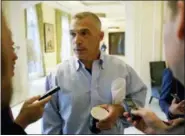  ?? JOHN RAOUX — THE ASSOCIATED PRESS ?? Former Yankees manager Joe Girardi talks with reporters at the annual MLB general managers’ meetings, Tuesday in Orlando, Fla.