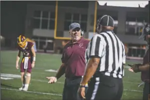  ?? The Sentinel-Record/Grace Brown ?? QUESTIONIN­G A CALL: Lake Hamilton head coach Tommy Gilleran talks with an official during the Wolves’ Sept. 20 game against Hot Springs. The Wolves travel to El Dorado tonight to kick off the conference season against the Wildcats.