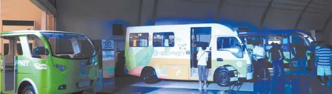  ??  ?? AN ELECTRIC minibus and jeepney displayed during the Public Transport Modernizat­ion Expo