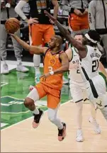  ?? Jonathan Daniel / Getty Images ?? Suns point guard Chris Paul is focused on bouncing back from a Game 4 loss in Milwaukee that tied the series 2-2. Paul had five turnovers in the loss.