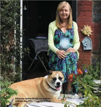  ?? Killarney author Breda Joy at home with her dog, Milo. Photo by Michelle Cooper Galvin ??