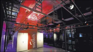  ?? Michael Quine Las Vegas Review-Journal @Vegas88s ?? The Switch data sector houses rows of multi-cabinet heat containmen­t chimney pods, which channel computer-generated heat up and out of the data center.