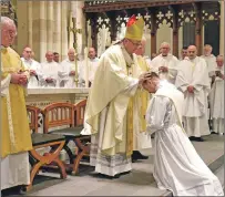  ?? Photograph: Paul McSherry ?? Laying on of the hands by Archbishop Tartaglia, and right, Father Toal’s family were there to support him.