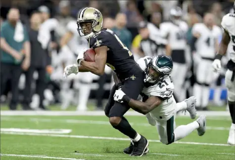  ?? Chris Graythen/Getty Images ?? Michael Thomas caught 12 passes for 171 yards, including the go-ahead touchdown in the third quarter, in the Saints’ 20-14 win against the Eagles Sunday at the Mercedes-Benz Superdome
