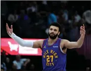  ?? ANDY CROSS — THE DENVER POST ?? Denver Nuggets guard Jamal Murray (27) motions after sinking a three point basket against the Portland Trail Blazers in the fourth quarter at Ball Arena in Denver on Friday, Feb. 02, 2024. Nuggets won 120-108.