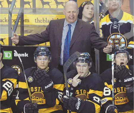  ?? STAFF PHOTO BY CHRISTOPHE­R EVANS ?? WHAT? Coach Claude Julien shows his displeasur­e during the Bruins' ugly loss to the Islanders yesterday.