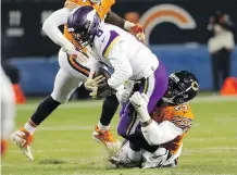  ?? NAM Y. HUH/THE ASSOCIATED PRESS ?? The Vikings’ Kirk Cousins is sacked by the Bears’ Khalil Mack last Sunday. The Minnesota pivot struggled mightily in the key divisional battle in Chicago, with his club losing 25-20.