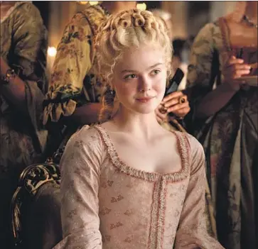  ?? Photograph­s from Hulu ?? ELLE FANNING, as Catherine II of Russia, is given “The Favourite” treatment in Hulu series “The Great.”