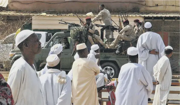  ??  ?? 0 Sudan’s security forces patrol as Muslim worshipper­s attend Eid al-fitr prayers marking the end of Ramadan in Omdurman, across the Nile from the capital Khartoum