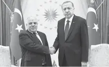  ?? EPA-Yonhap ?? Turkish President Recep Tayyip Erdogan, right, shakes hands with Iraqi Prime Minister Haider al-Abadi during their recent meeting in Ankara, Turkey.