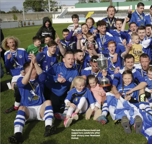  ??  ?? The Ashford Rovers team and supporters celebrate after their victory over Newtown United.