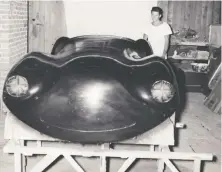  ??  ?? Frew with the completed fibreglass body for the sports car he built in his parents’ Kerrisdale basement in the mid-1950s.