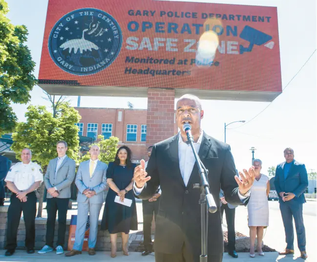  ?? ANDY LAVALLEY/POST-TRIBUNE ?? Mayor Jerome Prince speaks during the rollout ceremony for Operation Safe Zone outside U.S. Steel Yard in Gary on June 16. The citywide public safety initiative is designed to utilize camera feeds and other data from various sources to aid police.
