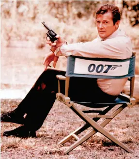  ?? AP FILE PHOTO ?? British actor Roger Moore, playing the title role of secret service agent 007, James Bond, is shown on location in England in 1972.