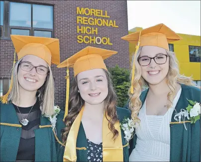  ?? PHOTOS BY MAUREEN COULTER/THE GUARDIAN ?? Allee Ryan, left, of Green Meadows, Hannah McBride of Scotchfort and Hailey Laybolt of Green Meadows at their graduation ceremony from Morell Regional High School June 22. The three girls describe feeling mixed emotions about the day but admit they are...