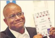  ?? AP ?? Paul Beatty poses with his book The Sellout after the Man Booker Prize ceremony in London on Tuesday.