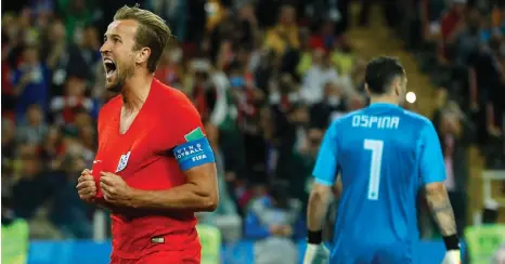  ?? Picture: AP PHOTO ?? BELIEVE IN US: An ecstatic Harry Kane runs to the English fans to celebrate after scoring a penalty against Colombia in Moscow yesterday.